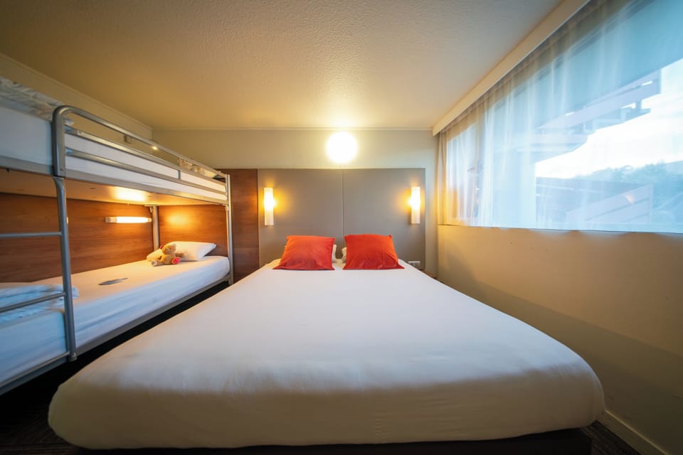 Family Room | Premium bedding, desk, blackout drapes, iron/ironing board