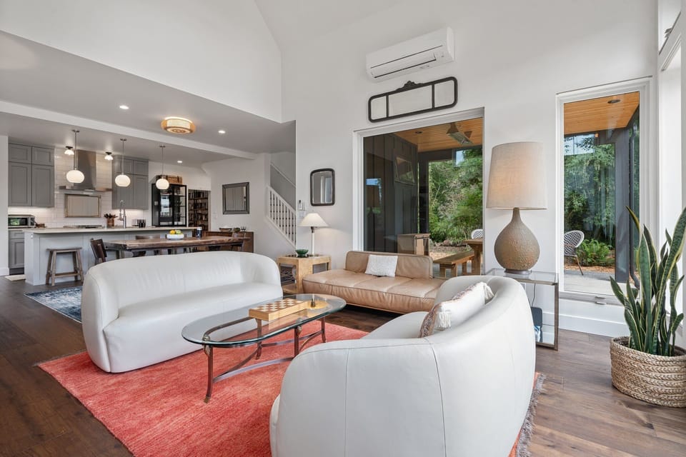 The Black Squirrel’s inviting layout flows with natural light, bold art, and cozy furnishings.