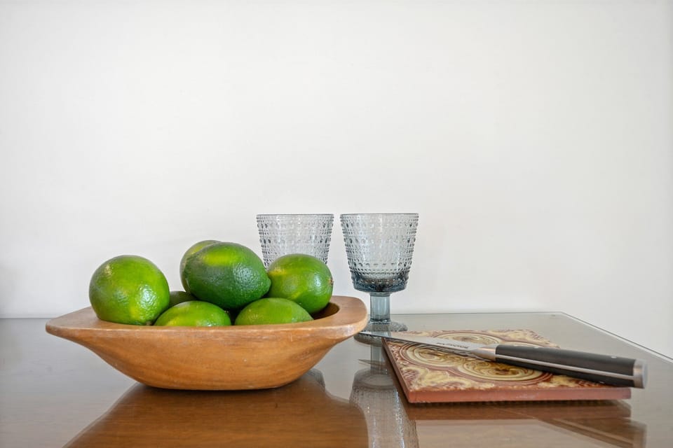Simple touches make a bold statement—from local fruit bowls to wood accents and polished surfaces.
