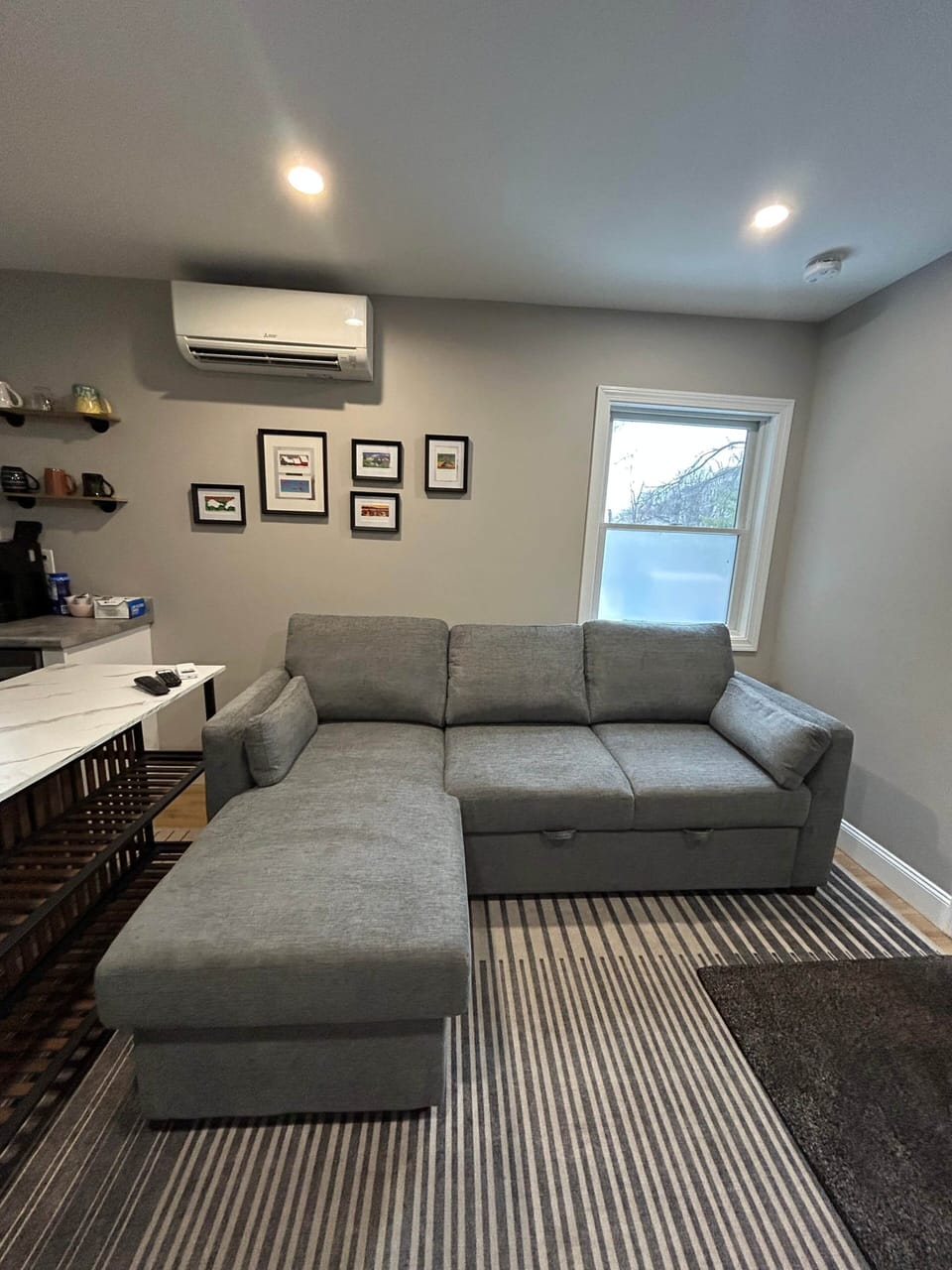 Enter into the living space with a pull out sleeper sofa and 50" TV. New couch as of 12.2025!