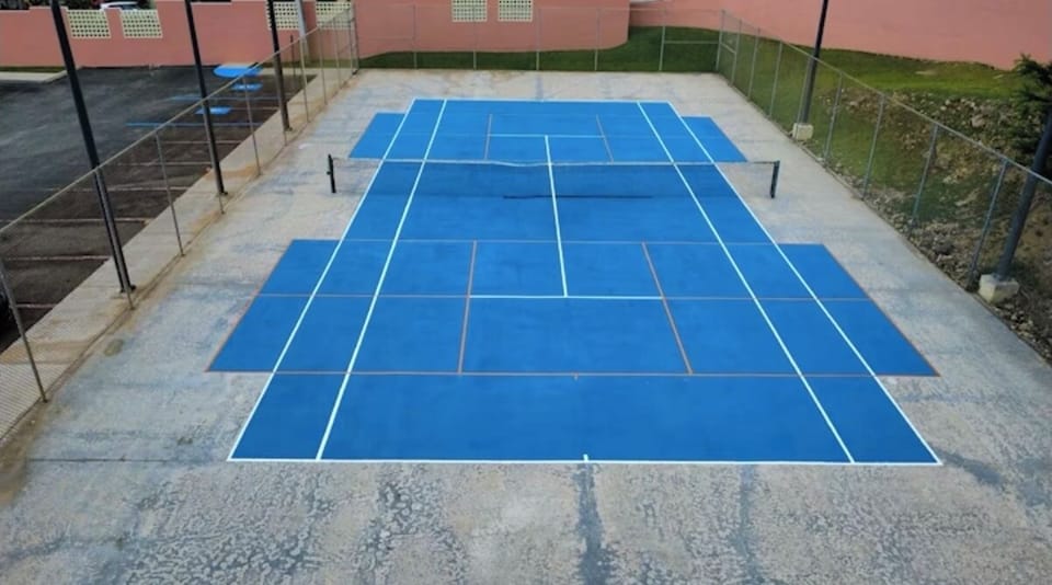 Serve up some fun on our vibrant tennis court! 
