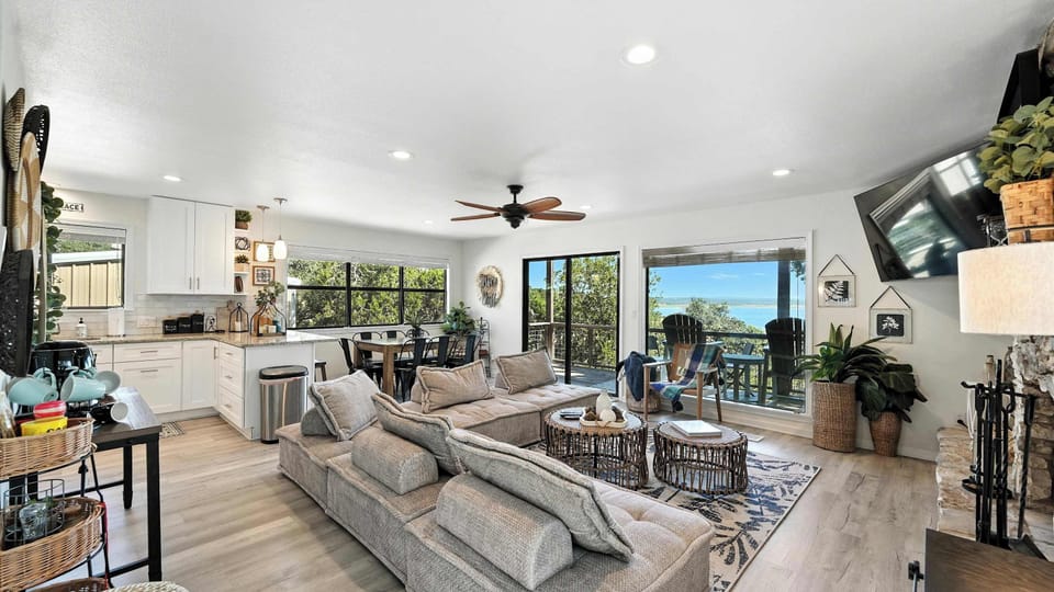 Sunlight pours in through large windows and sliding doors — wake up to lake views and a cheerful space.