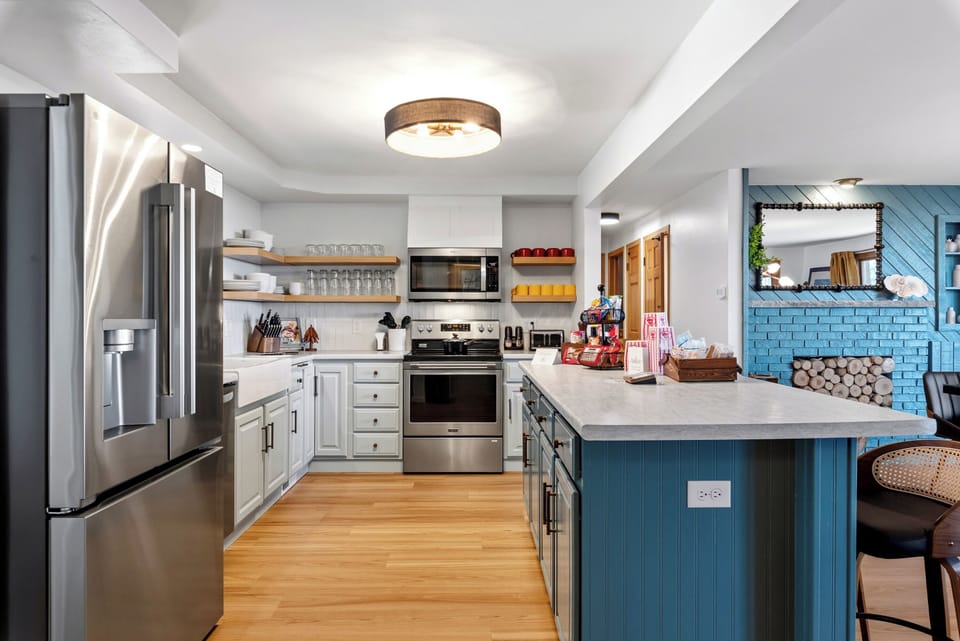 Plenty of room for your culinary creations in this lakeside meets farmhouse style kitchen. 