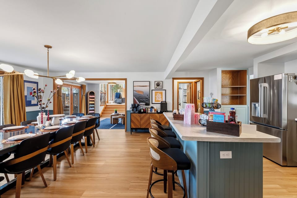 Open kitchen/dining area + coffee bar. 