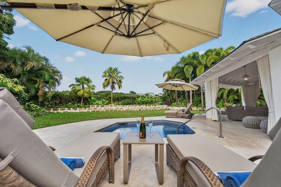 Relax poolside at Villa Grove