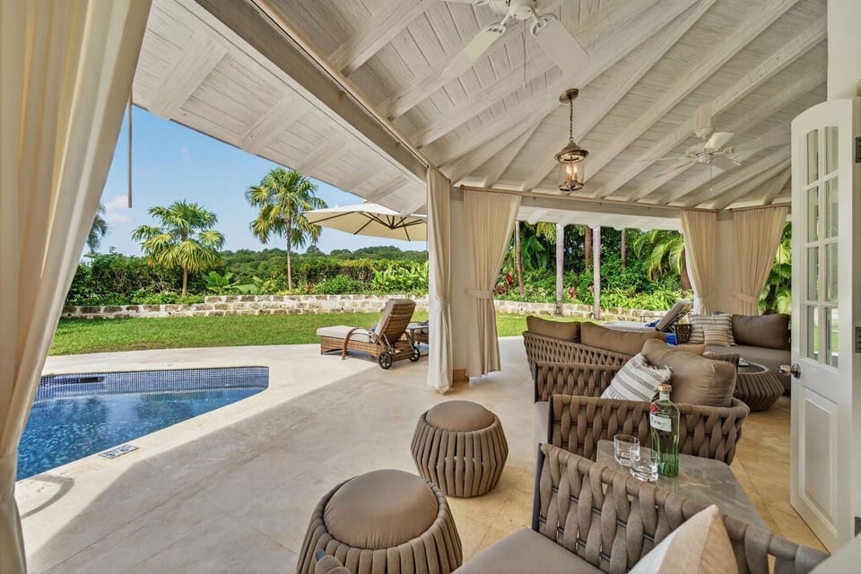 Covered patio overlooking the pool deck