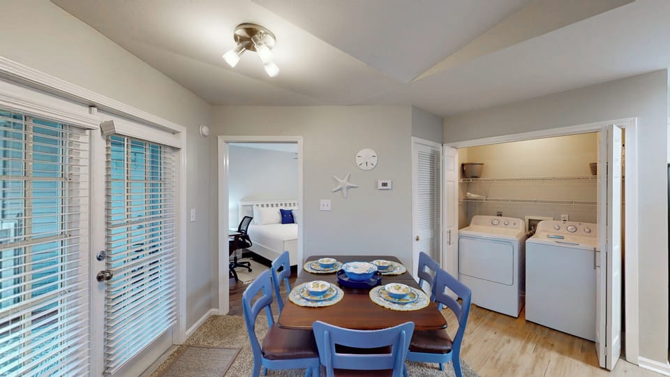 The dining table accommodates up to 6 guests ensuring everyone can enjoy meals together.