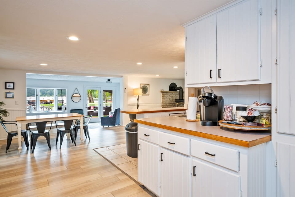 A bright and spacious kitchen with modern appliances, clean lines, and open shelving—perfect for preparing meals or enjoying your morning coffee. 🌟🍽️☕