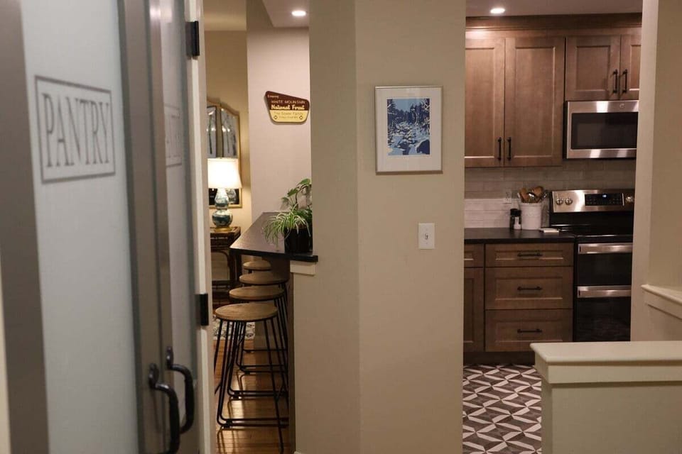 Pantry near the kitchen and dining room at Forest Knoll Condo in Waterville Valley, NH