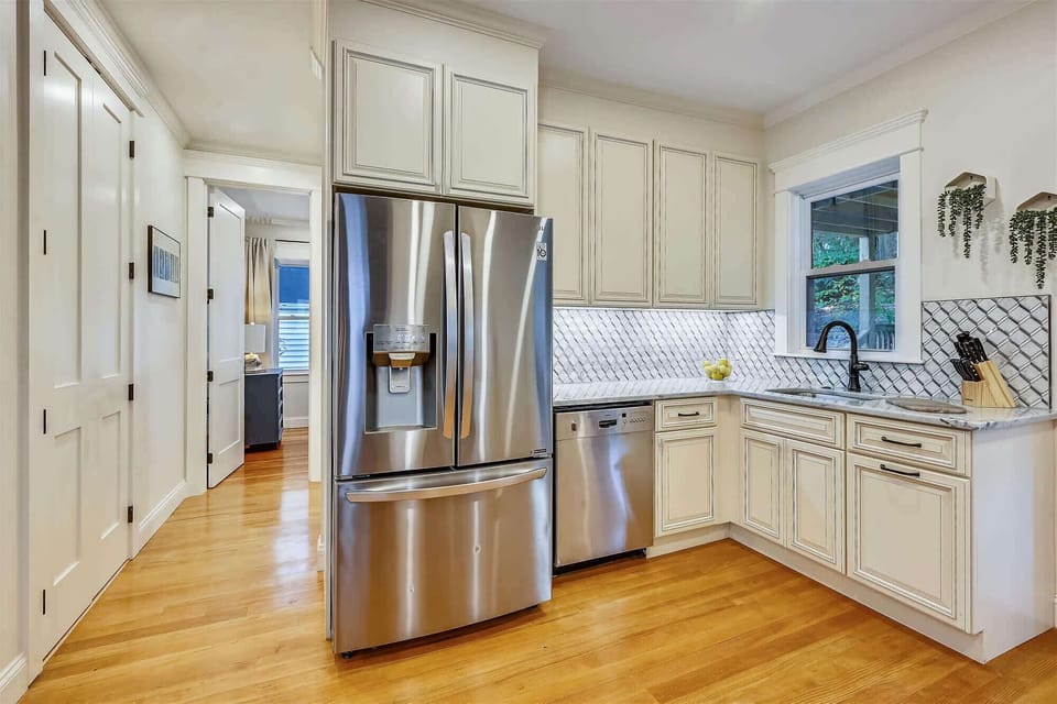 Unit 2 | Open Concept Chef's Kitchen | White Cabinetry | Island Seating | Second Floor
