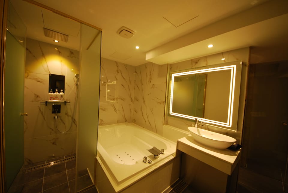 Designer toiletries, hair dryer, bathrobes, slippers