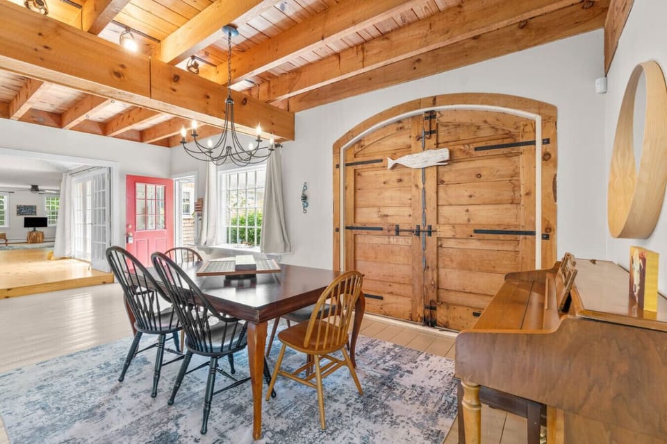 Seating available for family dinners at the kitchen island, high-top table and the dining table connected to the living room.