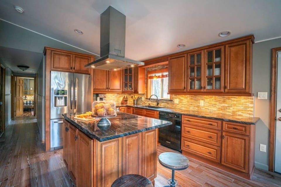 Chef's kitchen stocked with pots, pans and cooking basics. 