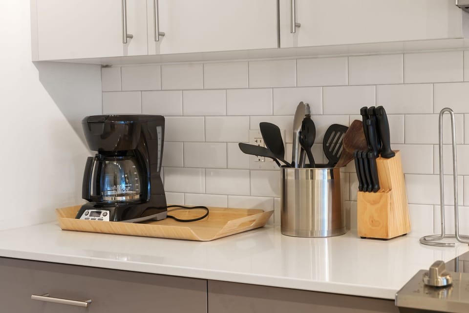 Coffee maker and complimentary coffee grounds provided