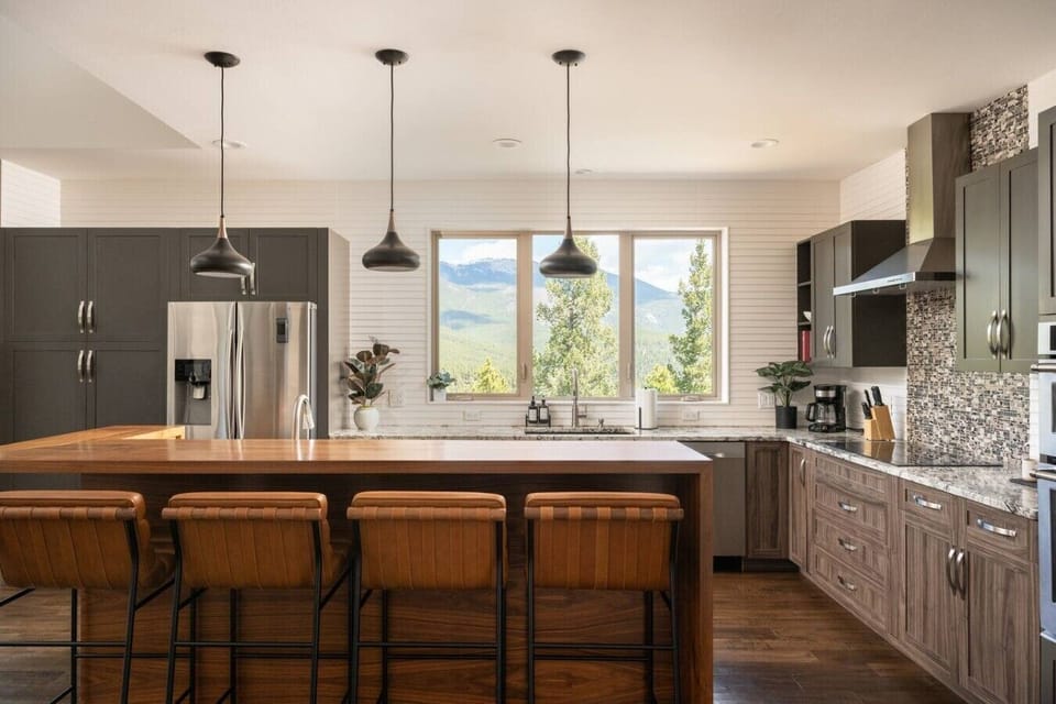 Beautifully remodeled chef`s kitchen with island and bar seating