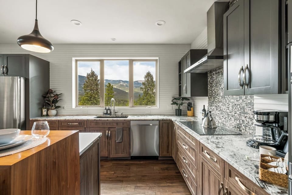 Beautifully remodeled chef`s kitchen with island and bar seating