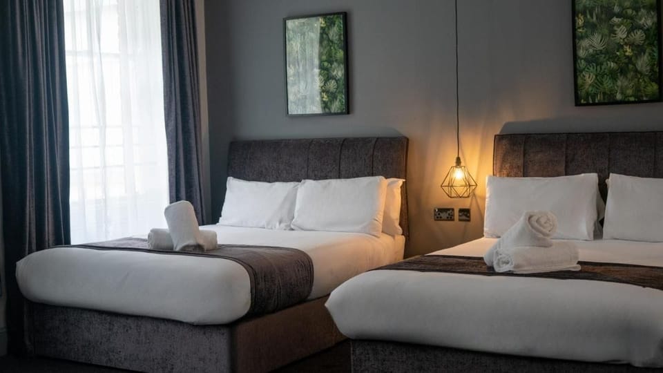 Comfort Quadruple Room | In-room safe, desk, blackout drapes, iron/ironing board