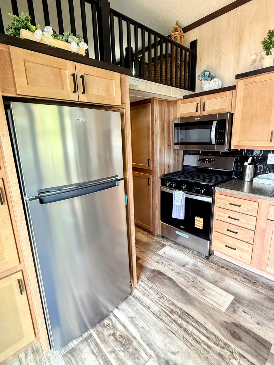 Well-appointed kitchen with a fridge and oven, making cooking easy and convenient.