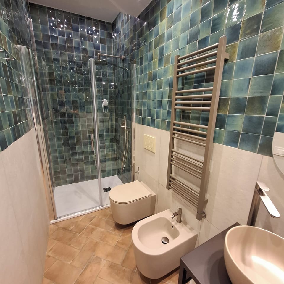 Bathroom | Shower, free toiletries, bathrobes, towels