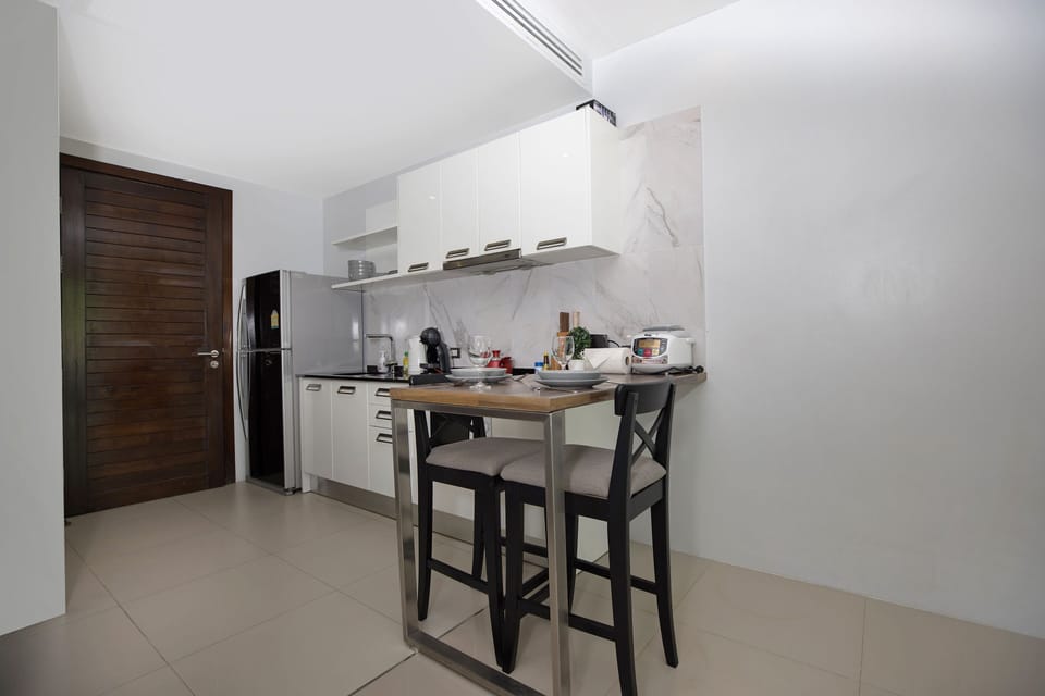 Exclusive Apartment, Balcony, Pool View | Private kitchen | Electric kettle
