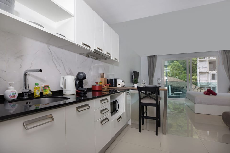 Exclusive Apartment, Balcony, Pool View | Private kitchen | Electric kettle