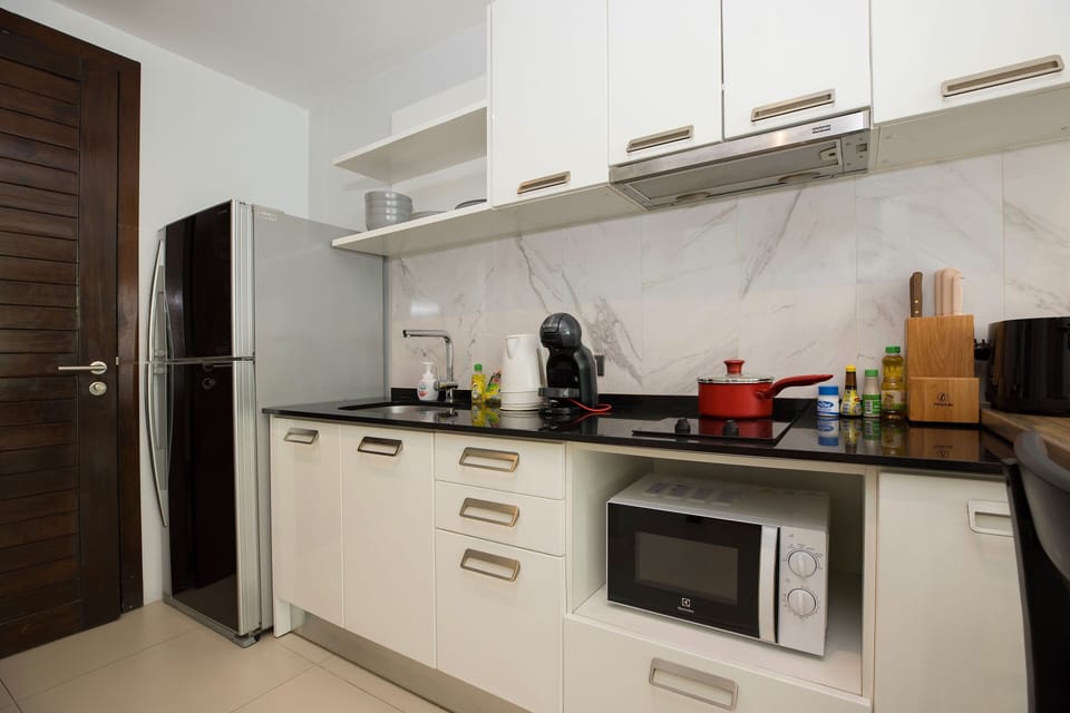 Exclusive Apartment, Balcony, Pool View | Private kitchen | Electric kettle