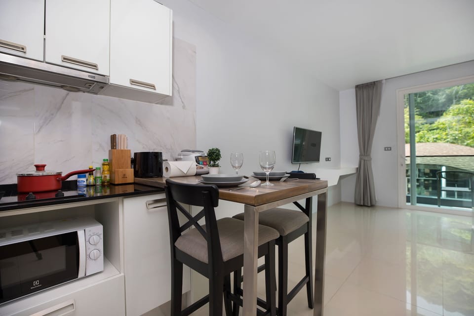 Exclusive Apartment, Balcony, Pool View | In-room dining