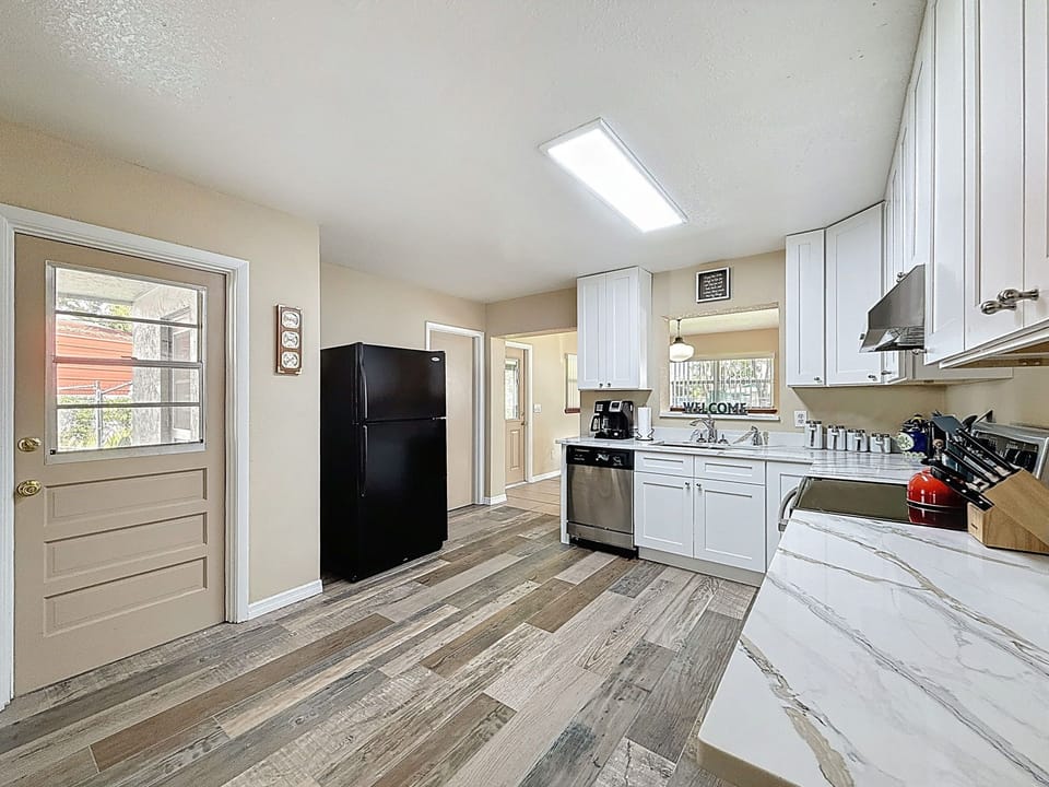 Kitchen showing door that exits to the carport
