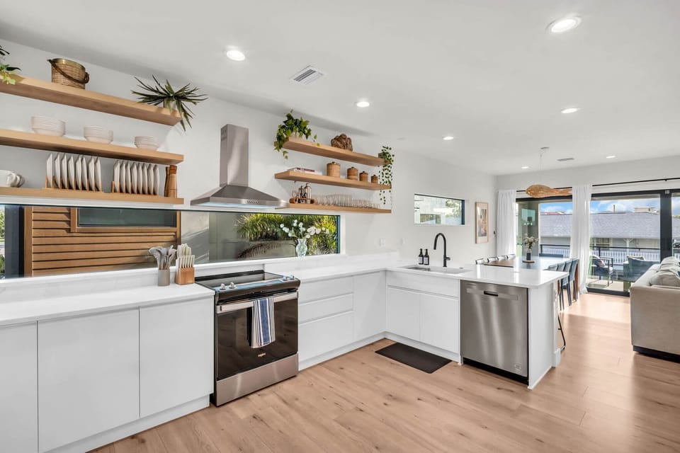 Warm kitchen nook styled w/ natural wood & greenery
