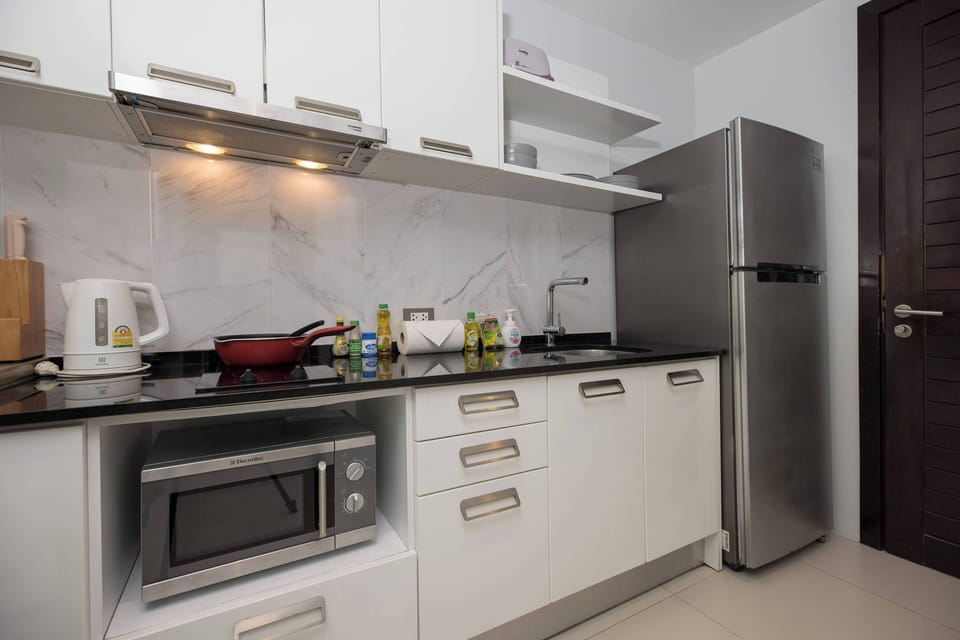 Exclusive Apartment, Balcony, Pool View | Private kitchen | Electric kettle