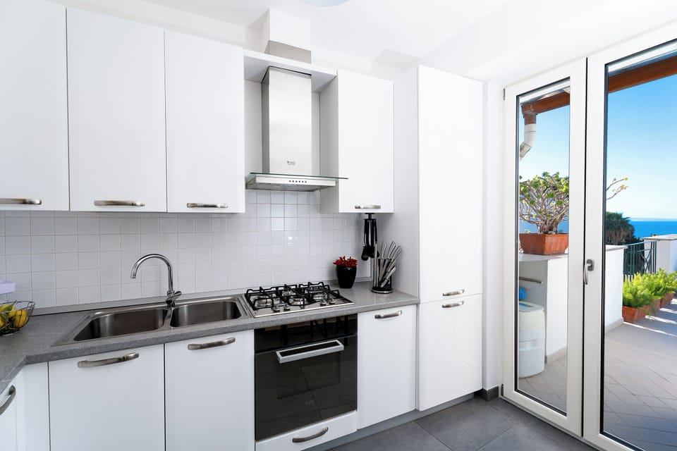 Design Apartment, 2 Bedrooms, Sea View | Private kitchen | Espresso maker, coffee/tea maker, electric kettle