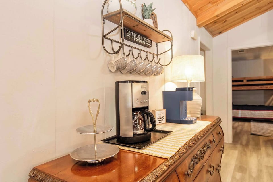 Coffee bar equipped with both a drip coffee maker and Keurig, perfect for your morning brew. Bring your own coffee supplies.