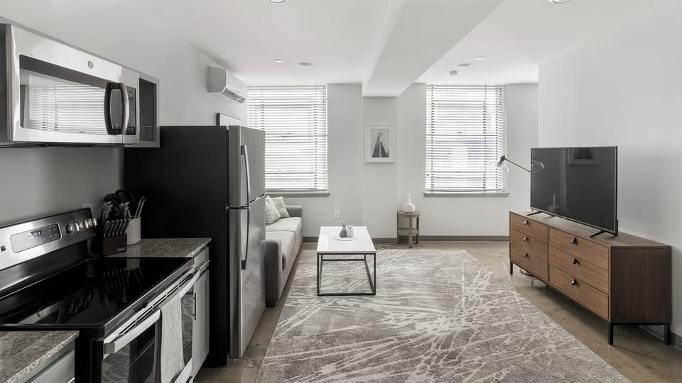 Apartment, 1 Bedroom | Living area | 50-inch TV with digital channels