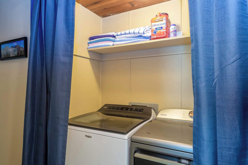 Laundry area with provided amenities.