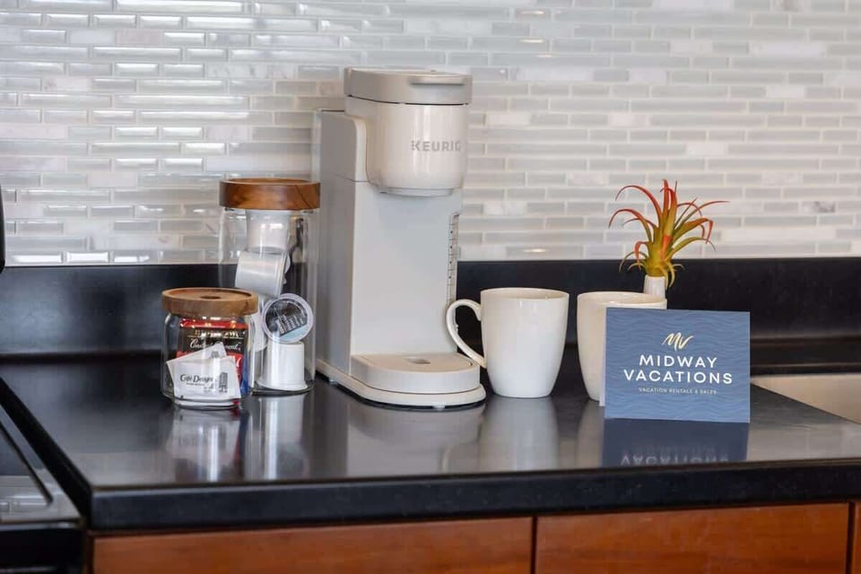 Enjoy your morning brew with a convenient Keurig coffee maker and a selection of coffee pods, perfectly set up on your sleek countertop