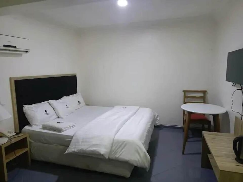 Economy Room, Balcony, City View | Desk, laptop workspace, blackout drapes, soundproofing