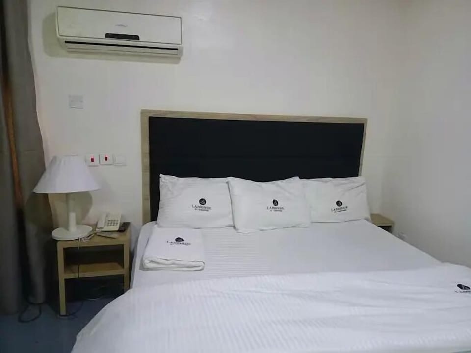 Economy Room, Balcony, City View | Desk, laptop workspace, blackout drapes, soundproofing