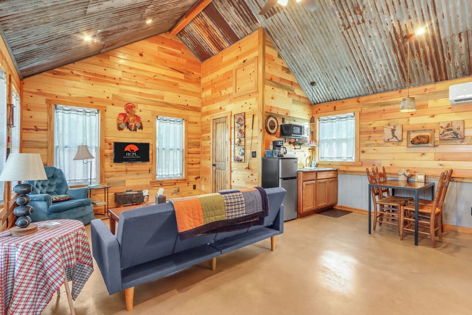 View from the entry door looking left into the cabin.  The door to the bathroom is in the corner.