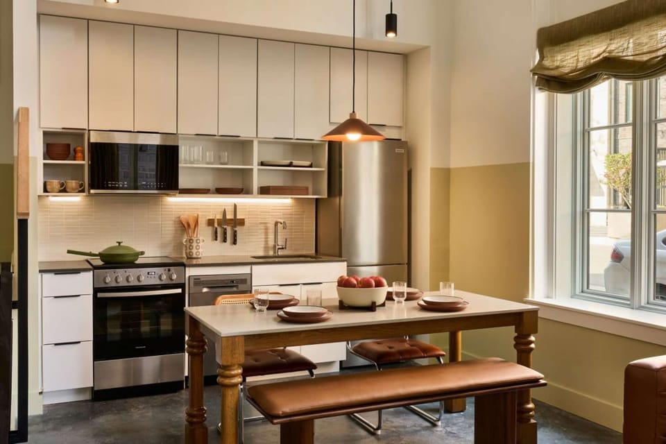Kitchen with wood table and comfy bench by the window