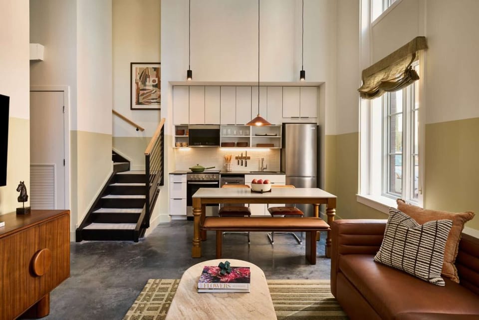 Kitchen with high ceilings and hanging lights