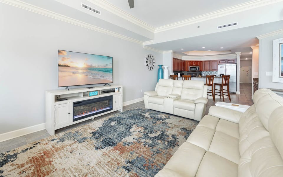 Sink into plush seating while enjoying your favorite show on the large screen, surrounded by a cozy vibe