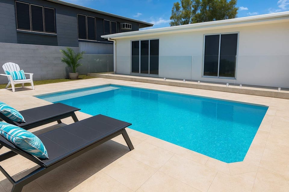 Private swimming pool with sun loungers for relaxing and cooling off