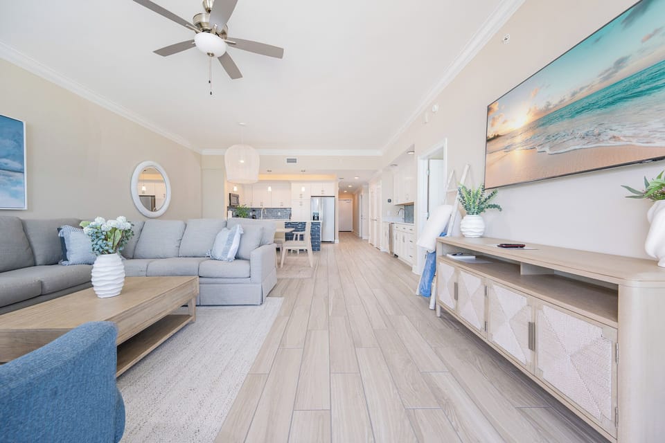 Relax in the family room with soft seating, a stylish coffee table, and a large TV for entertainment