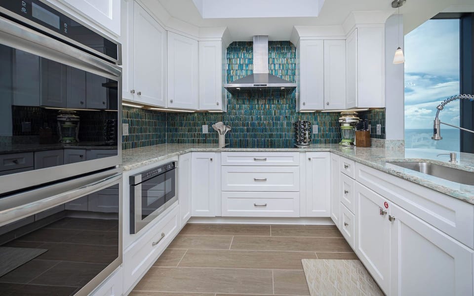 Upgrade your culinary experience in this modern kitchen with an elegant design and creative innovations