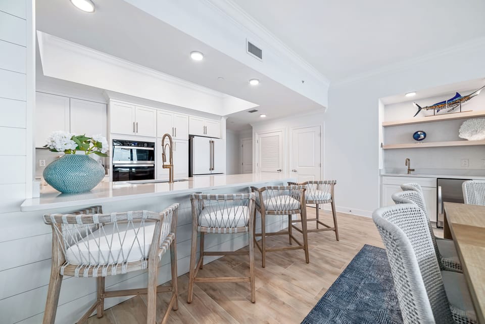 Enjoy meals at the stylish breakfast bar, surrounded by comfortable seating and elegant decor