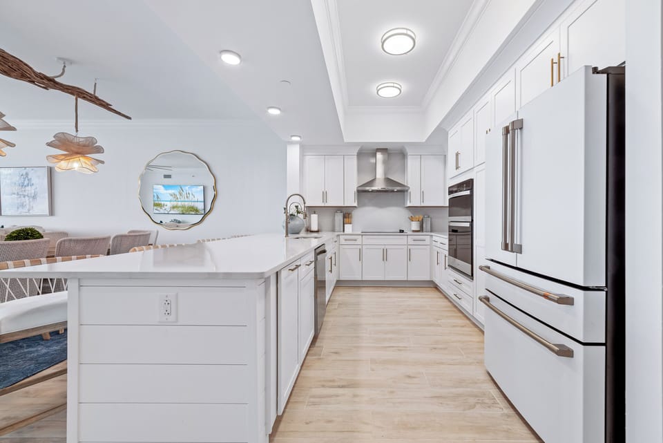 Prepare meals in this stylish kitchen featuring sleek cabinetry and upgraded modern appliances