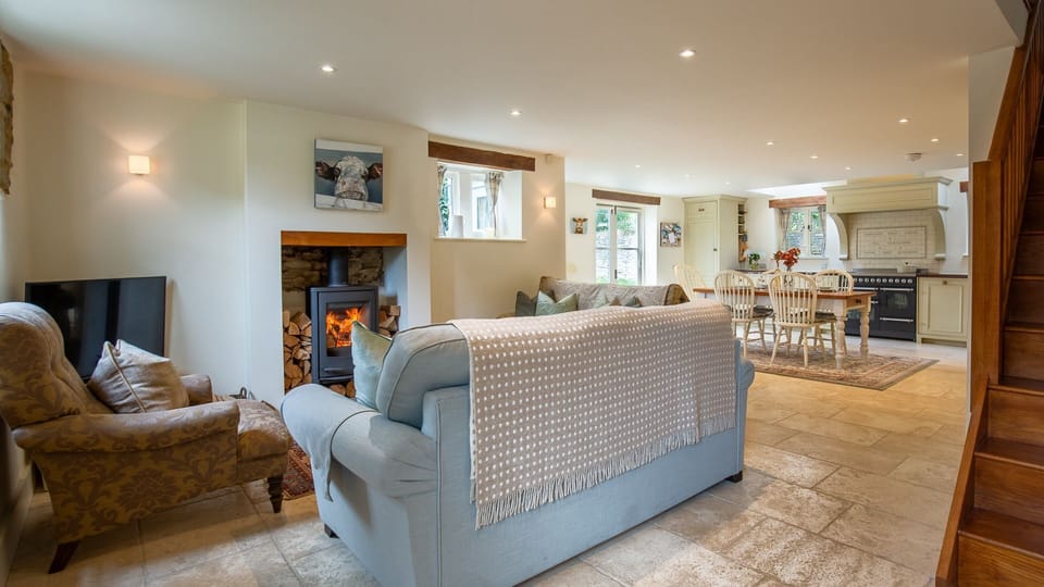 The cosy sitting area is set around a woodburning stove