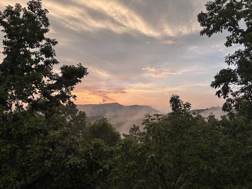 As the day winds down, unwind with a front-row seat to nature’s show—misty ridges, golden skies, and that peaceful Smoky Mountain stillness.