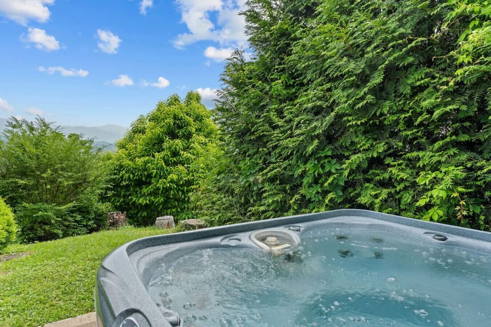 Sink into the bubbling hot tub and let the mountain air melt your stress away—your private spa moment awaits.