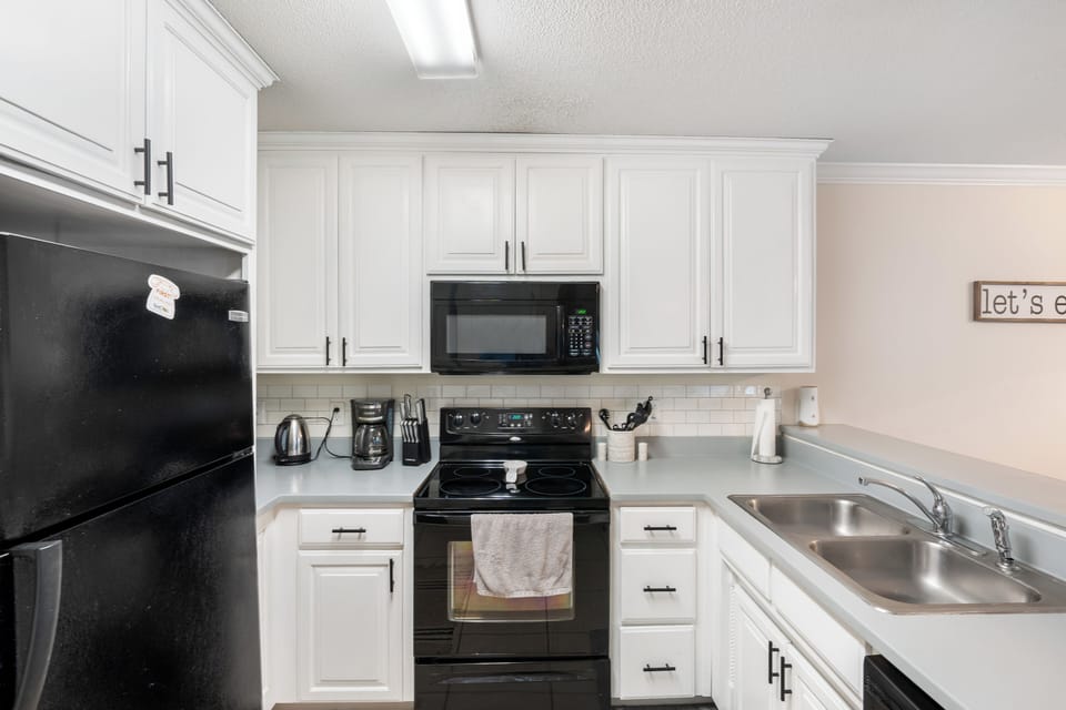 A bright kitchen with all the essentials you need to curate a delicious meal!
